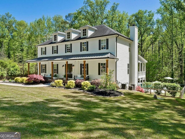650 Jones Rd, Roswell, GA 30075 - view of front of property featuring a porch, cooling unit, a chimney, and a front lawn