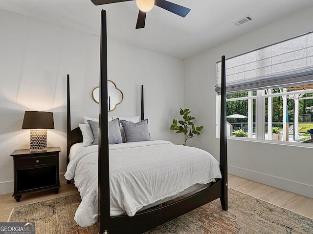 650 Jones Rd, Roswell, GA 30075 - bedroom with visible vents, a ceiling fan, baseboards, and wood finished floors