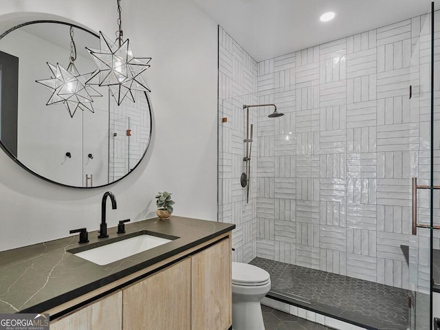 650 Jones Rd, Roswell, GA 30075 - bathroom with vanity, toilet, a chandelier, recessed lighting, and tiled shower