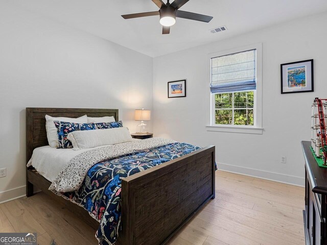 650 Jones Rd, Roswell, GA 30075 - bedroom with visible vents, a ceiling fan, baseboards, and light wood-type flooring