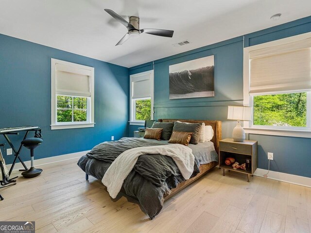 650 Jones Rd, Roswell, GA 30075 - bedroom with baseboards, visible vents, and hardwood / wood-style flooring