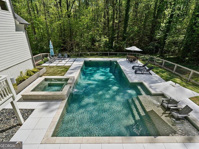 650 Jones Rd, Roswell, GA 30075 - view of pool with an in ground hot tub, a patio area, a fenced in pool, a wooded view, and a fenced backyard