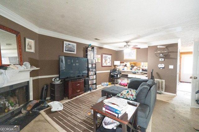 carpeted living room with crown molding, ceiling fan, visible vents, and a fireplace
