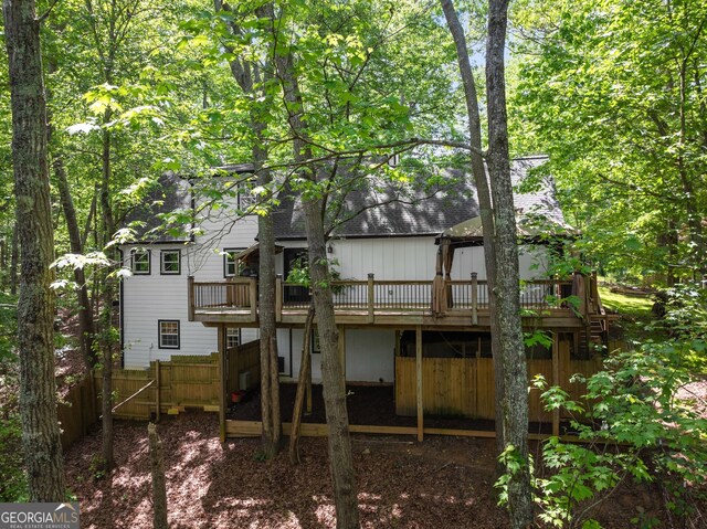 364 Cherokee Trce, Dahlonega, GA 30533 - rear view of house with roof with shingles, fence, and a wooden deck