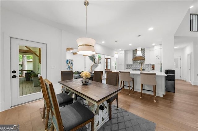 dining room featuring a healthy amount of sunlight, recessed lighting, and light wood finished floors