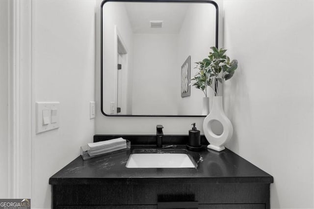 bathroom featuring vanity and visible vents
