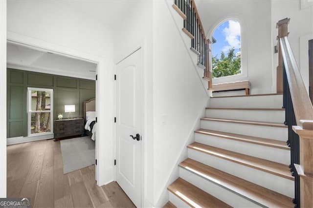staircase with wood finished floors