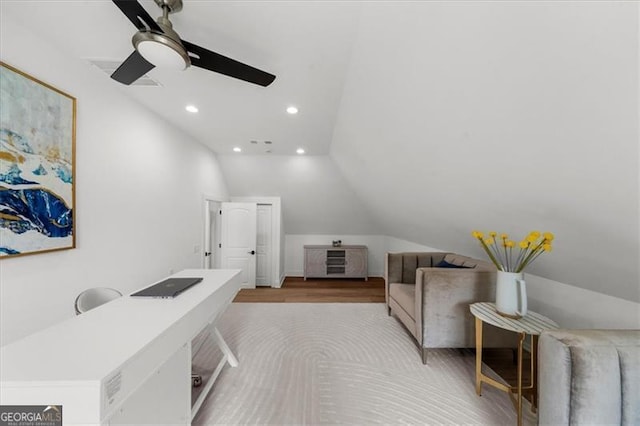 home office featuring light wood finished floors, a ceiling fan, recessed lighting, and lofted ceiling