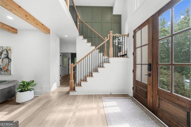 entryway featuring recessed lighting, baseboards, stairway, and french doors