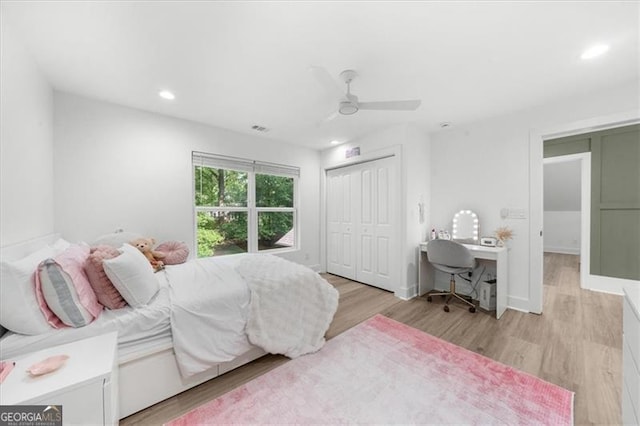 bedroom featuring a closet, recessed lighting, light wood-style flooring, and visible vents