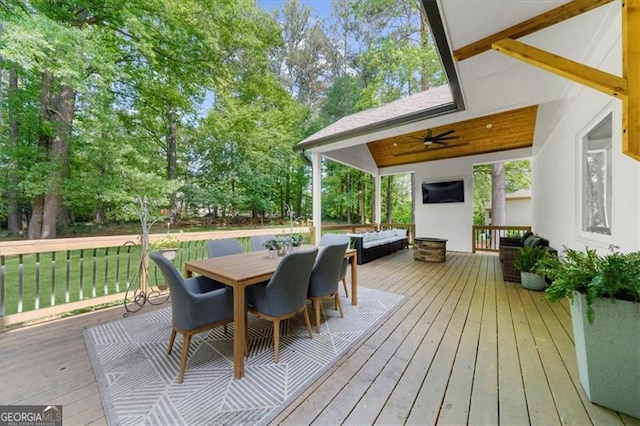 deck with ceiling fan and outdoor dining space