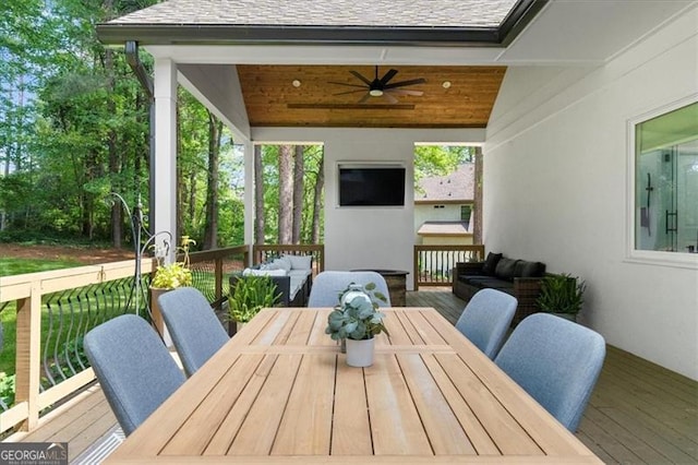 exterior space featuring a ceiling fan, an outdoor hangout area, and outdoor dining space