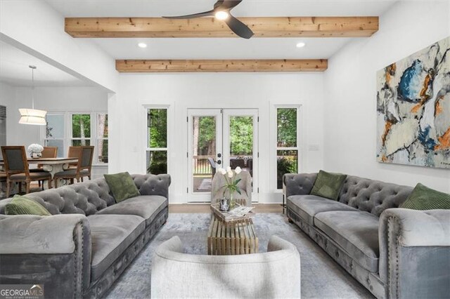 living room featuring ceiling fan, french doors, beamed ceiling, light wood-style floors, and recessed lighting