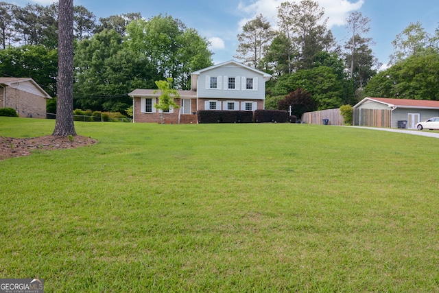 view of front of property featuring brick siding and a front lawn