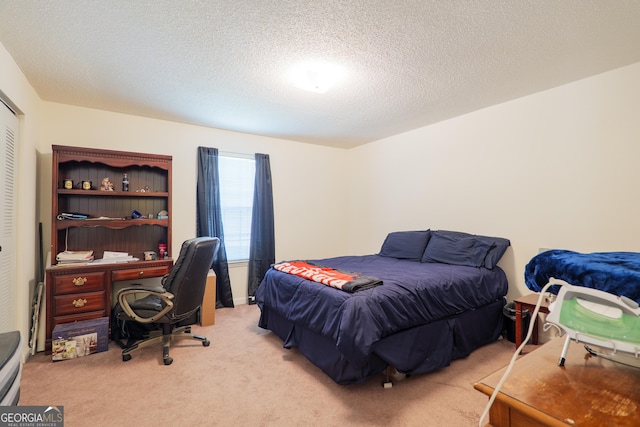 1921 Gornto Rd Unit 10, Valdosta, GA 31602 - bedroom with light colored carpet, a textured ceiling, and a closet