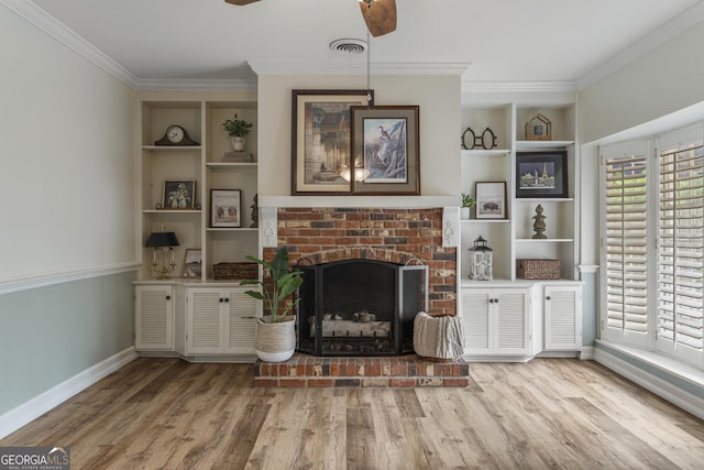 603 Piney Woods Dr, Lagrange, GA 30240 - living room featuring visible vents, ornamental molding, ceiling fan, and a fireplace