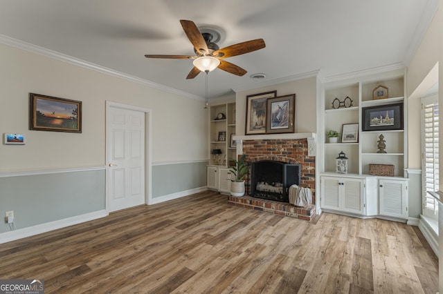 603 Piney Woods Dr, Lagrange, GA 30240 - unfurnished living room with plenty of natural light, ceiling fan, a brick fireplace, and wood finished floors