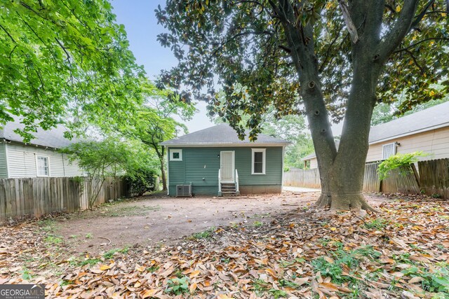 2497 Lakewood Ave SW, Atlanta, GA 30315 - rear view of house featuring a fenced backyard, central AC, and entry steps