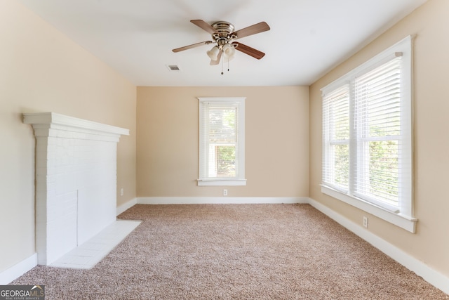 2497 Lakewood Ave SW, Atlanta, GA 30315 - unfurnished living room featuring carpet flooring, a ceiling fan, baseboards, and visible vents