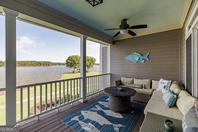 deck featuring a water view, a yard, outdoor lounge area, and ceiling fan
