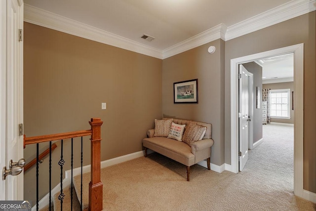 sitting room featuring crown molding, light carpet, baseboards, an upstairs landing, and visible vents