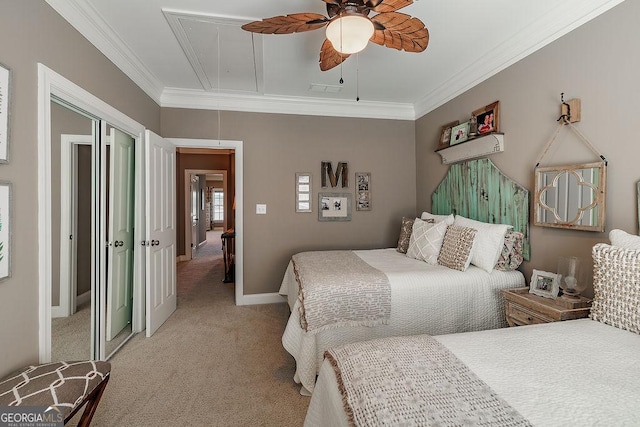 bedroom featuring attic access, visible vents, crown molding, a closet, and light carpet