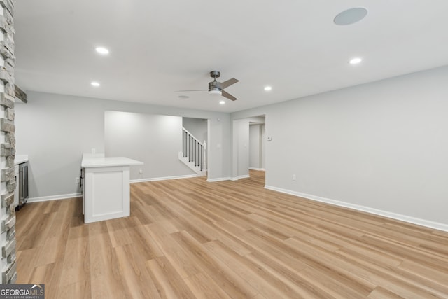 110 Keswick Way, Alpharetta, GA 30022 - interior space with a stone fireplace, light wood-style floors, ceiling fan, stairway, and recessed lighting