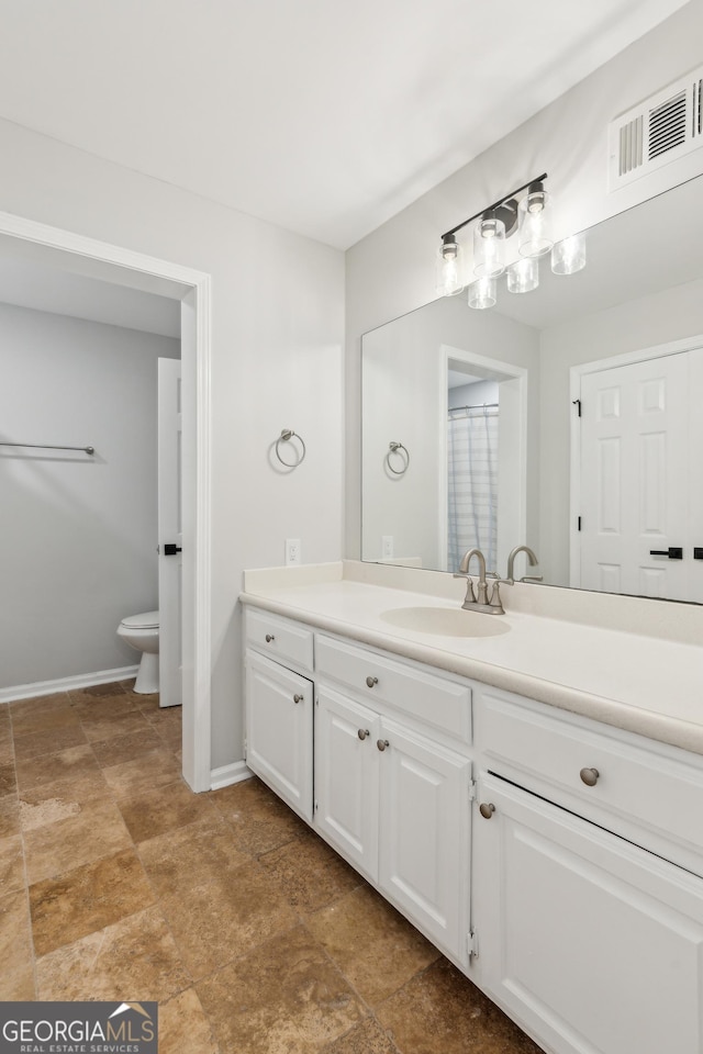 110 Keswick Way, Alpharetta, GA 30022 - bathroom featuring visible vents, baseboards, toilet, and vanity