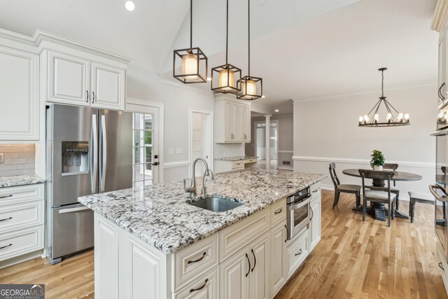 110 Keswick Way, Alpharetta, GA 30022 - kitchen featuring a sink, appliances with stainless steel finishes, white cabinets, and light wood-style floors