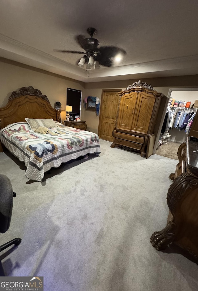 182 Boxer Ln, Rock Spring, GA 30739 - carpeted bedroom featuring a raised ceiling, a walk in closet, and ceiling fan