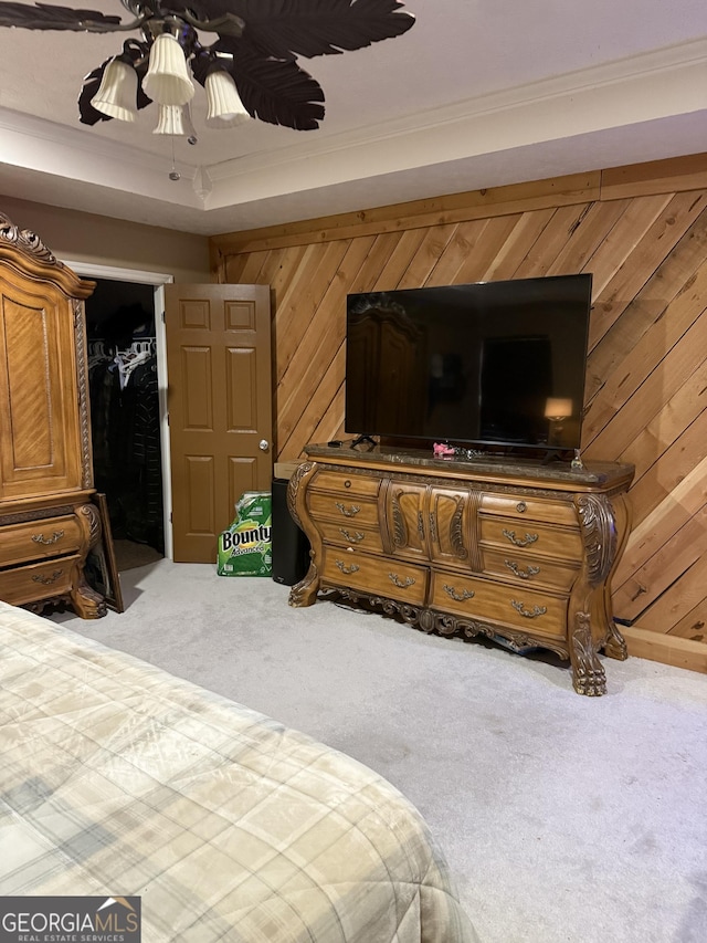 182 Boxer Ln, Rock Spring, GA 30739 - carpeted bedroom with wood walls, ornamental molding, ceiling fan, a closet, and a walk in closet