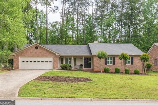ranch-style house featuring covered porch, driveway, brick siding, a front lawn, and an attached garage
