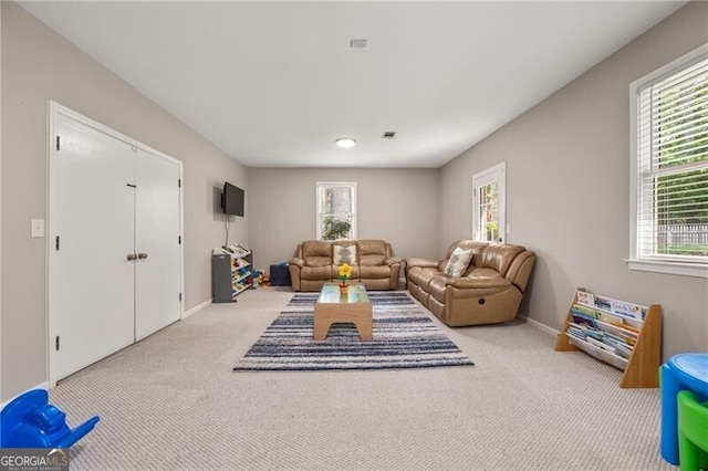 living room with carpet floors and baseboards