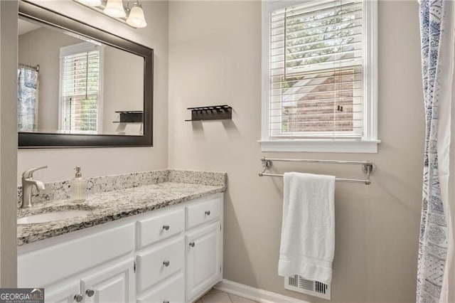 bathroom with baseboards and vanity