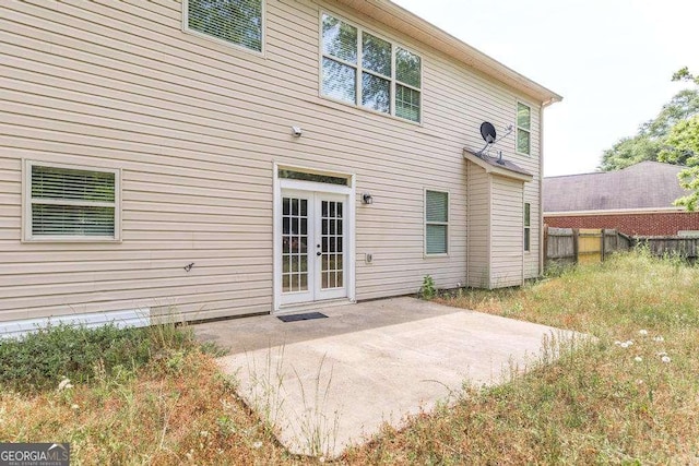 back of property with french doors and a patio area