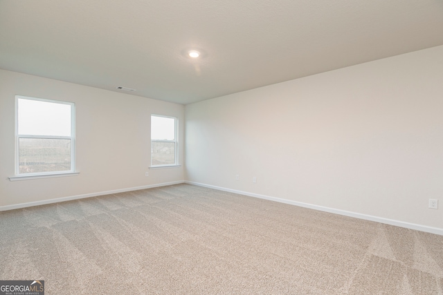 264 Oliver Dr, Locust Grove, GA 30248 - empty room featuring baseboards, light colored carpet, and visible vents