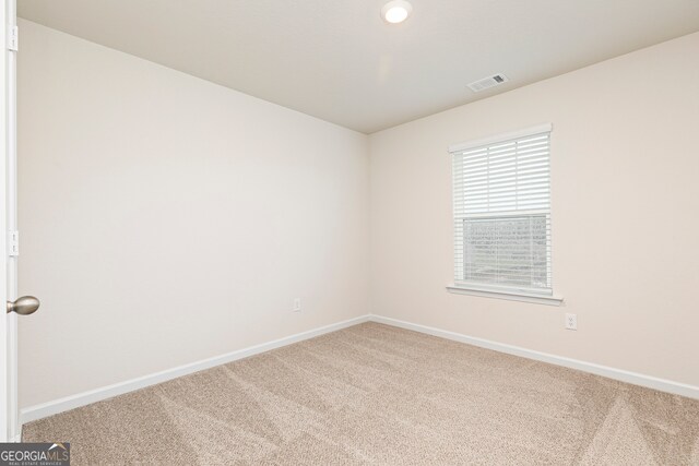264 Oliver Dr, Locust Grove, GA 30248 - unfurnished room with visible vents, carpet flooring, and baseboards