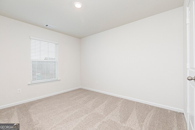 264 Oliver Dr, Locust Grove, GA 30248 - empty room with baseboards, visible vents, and carpet