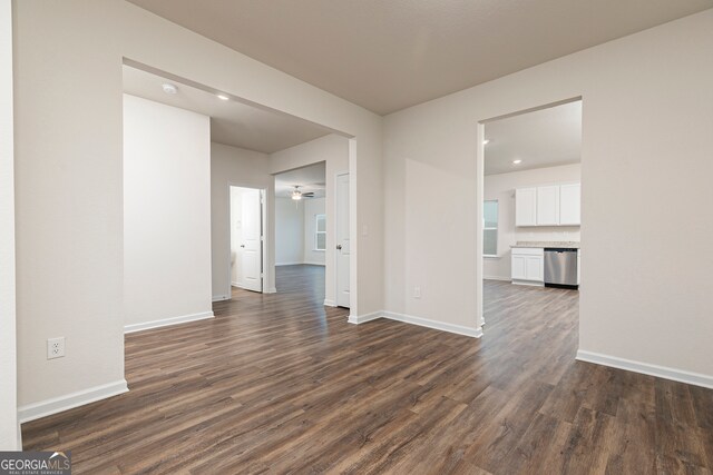 264 Oliver Dr, Locust Grove, GA 30248 - unfurnished room with baseboards, a ceiling fan, and dark wood-style flooring