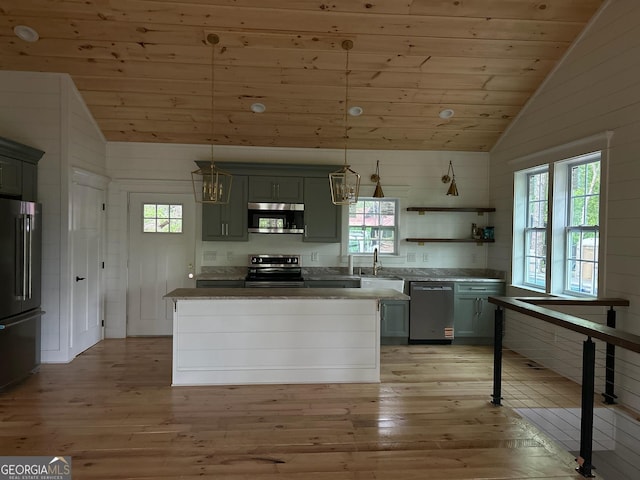 kitchen with wooden ceiling, appliances with stainless steel finishes, vaulted ceiling, and a wealth of natural light
