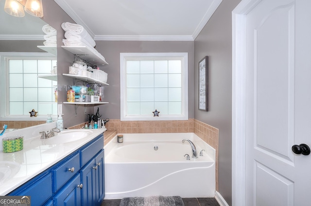 full bathroom featuring a garden tub, a sink, crown molding, and double vanity