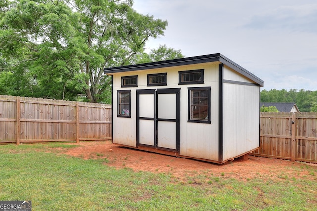 view of shed featuring a fenced backyard