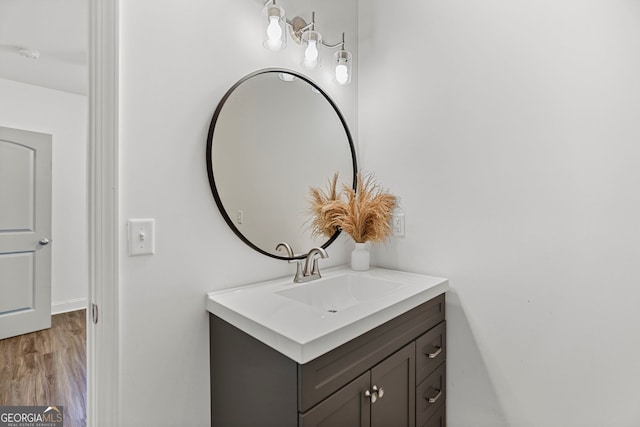 bathroom featuring vanity and wood finished floors