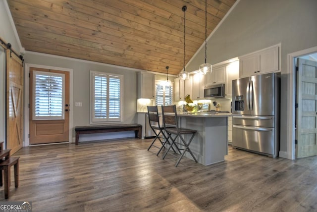 20 Mohawk Trl, Ellijay, GA 30540 - kitchen with white cabinets, appliances with stainless steel finishes, a breakfast bar area, high vaulted ceiling, and wood ceiling