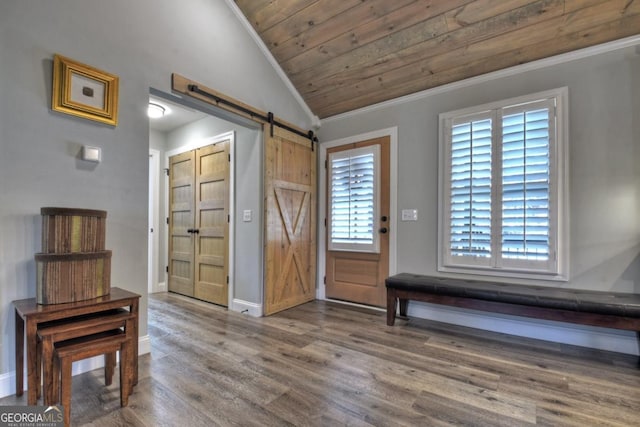 20 Mohawk Trl, Ellijay, GA 30540 - entryway featuring wood ceiling, vaulted ceiling, a barn door, wood finished floors, and baseboards