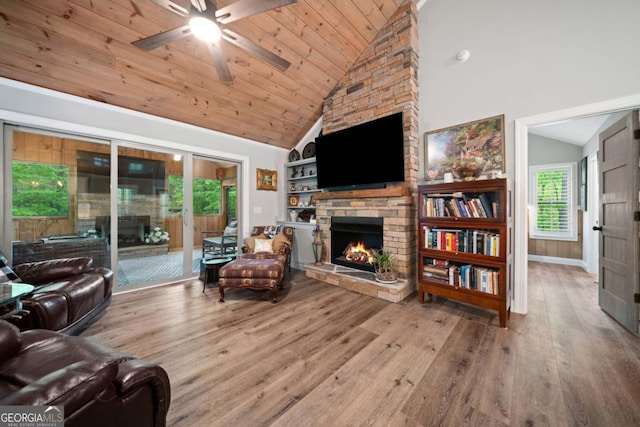 20 Mohawk Trl, Ellijay, GA 30540 - living area featuring wood finished floors, a stone fireplace, high vaulted ceiling, wood ceiling, and a ceiling fan
