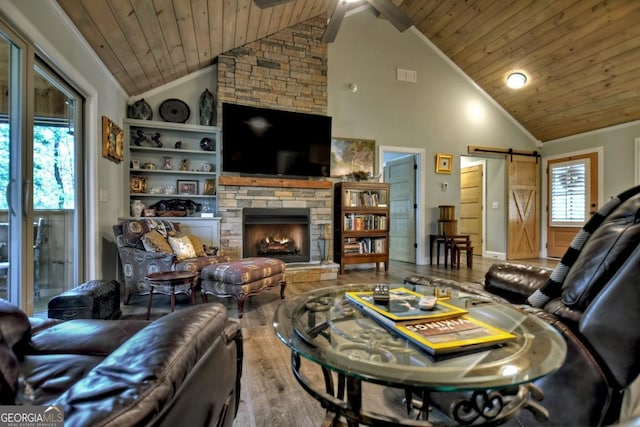 20 Mohawk Trl, Ellijay, GA 30540 - living room featuring ceiling fan, a barn door, a stone fireplace, wood finished floors, and wood ceiling
