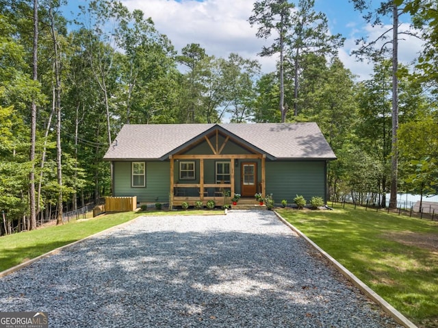 20 Mohawk Trl, Ellijay, GA 30540 - view of front of house with a porch, roof with shingles, fence, and driveway