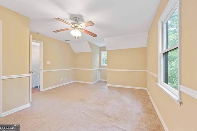 1007 Natalie Ln SE, Smyrna, GA 30082 - carpeted spare room featuring vaulted ceiling, baseboards, and a ceiling fan