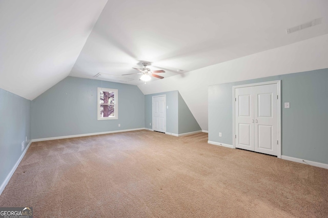 1007 Natalie Ln SE, Smyrna, GA 30082 - additional living space with ceiling fan, visible vents, carpet floors, baseboards, and vaulted ceiling